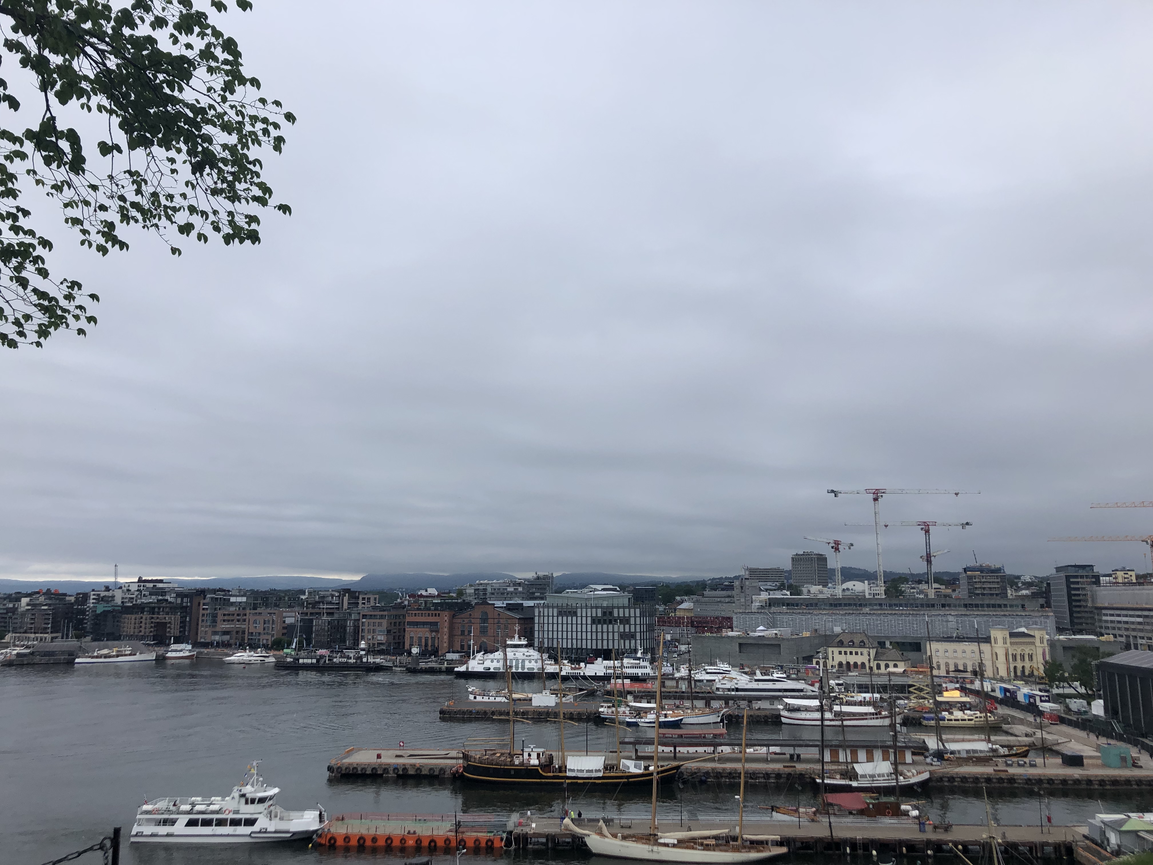 View of downtown Oslo with water and a mix of old and new buildings.