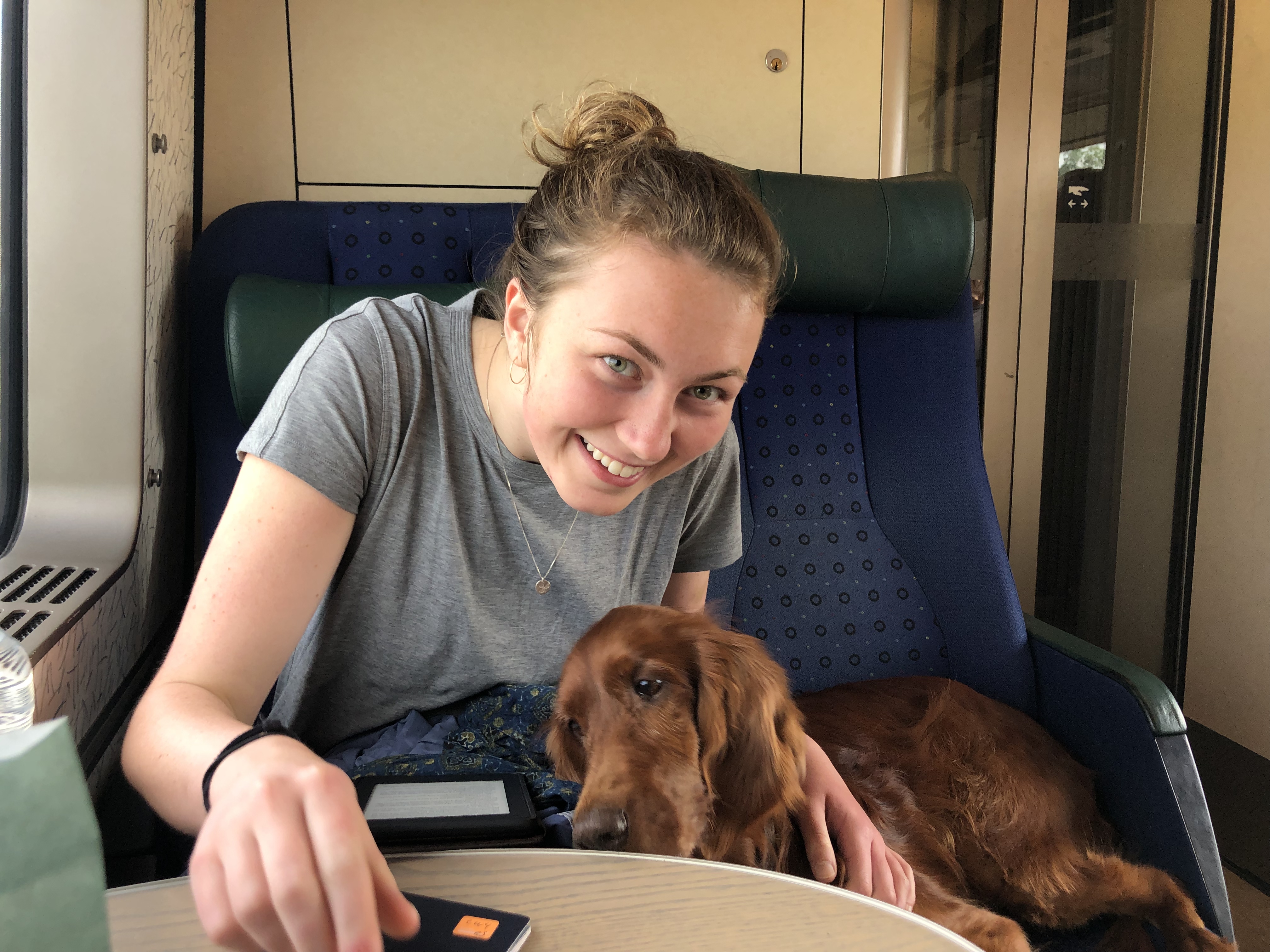 Me and a red-haired dog on a train.