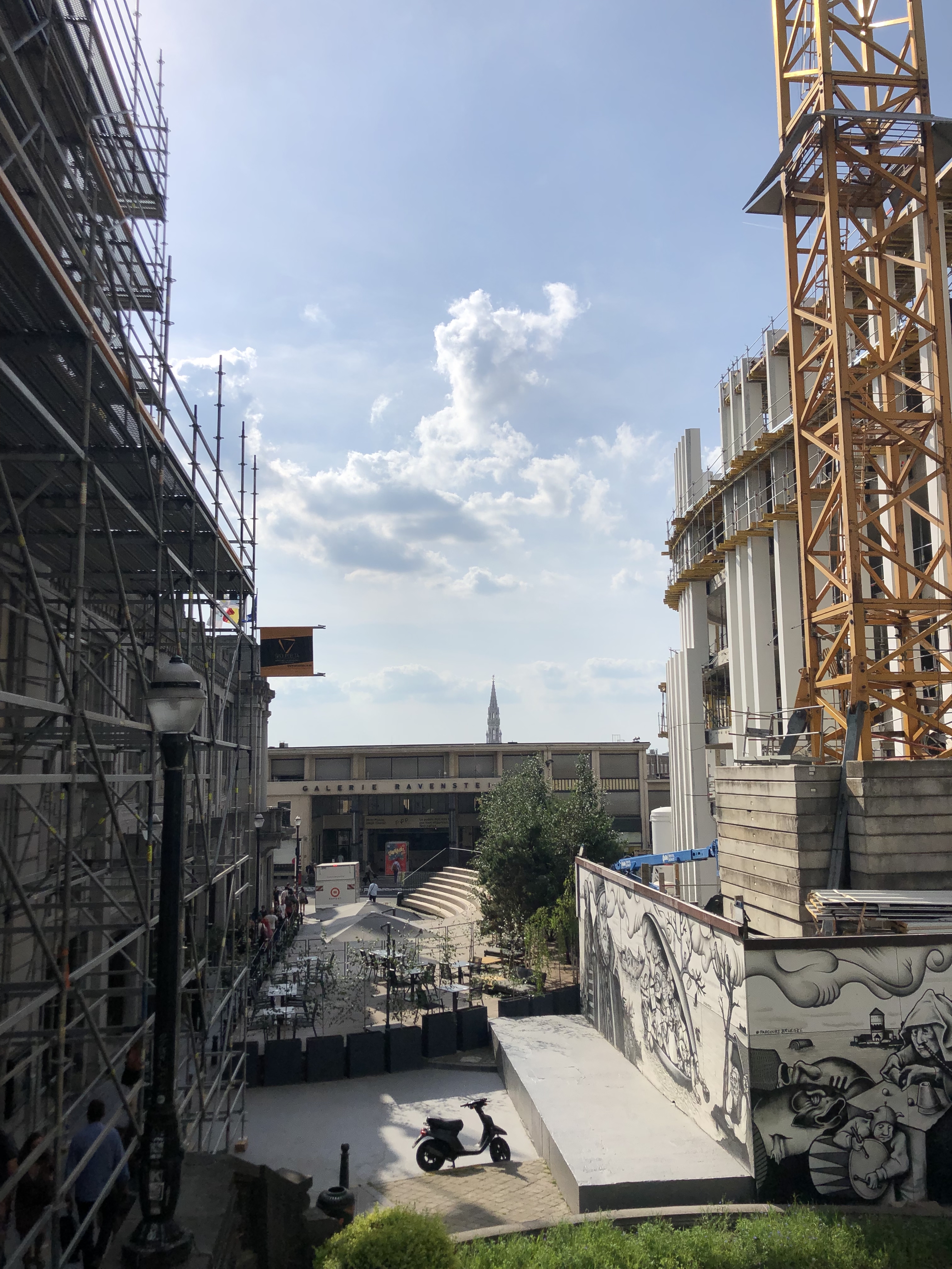 View outside the movie theater. Buildings, some construction.