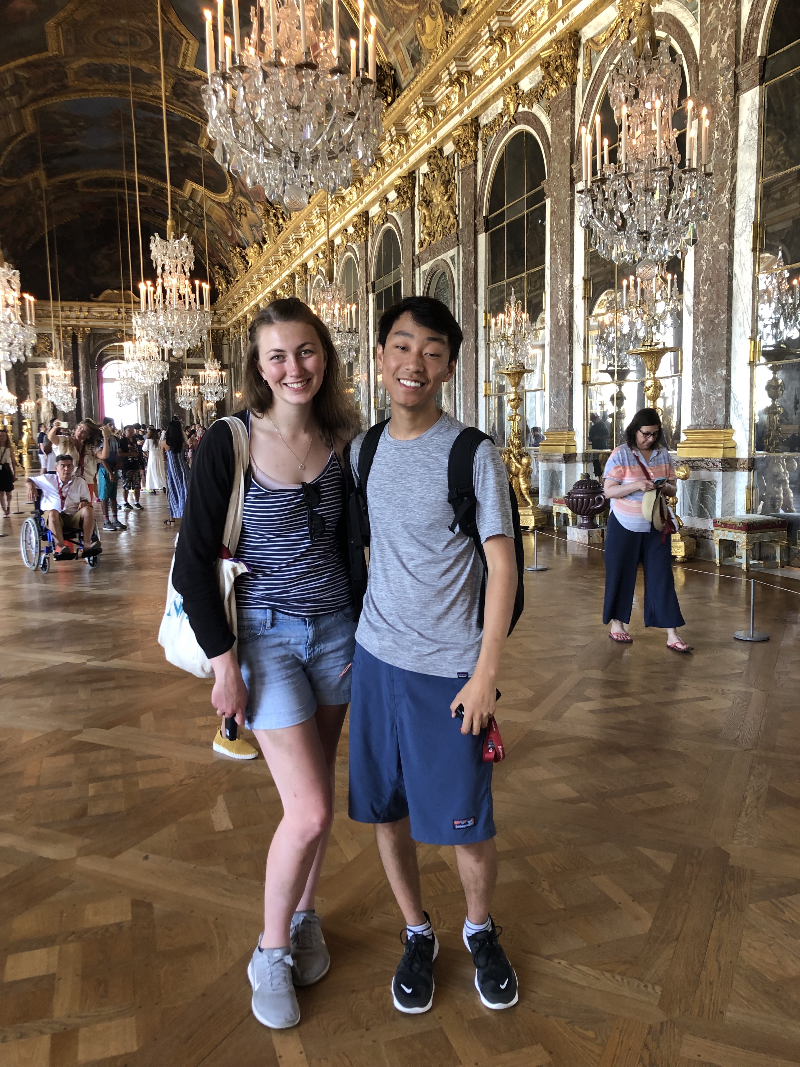 me and nelson surrounded by rich fixtures in the palace of versailles